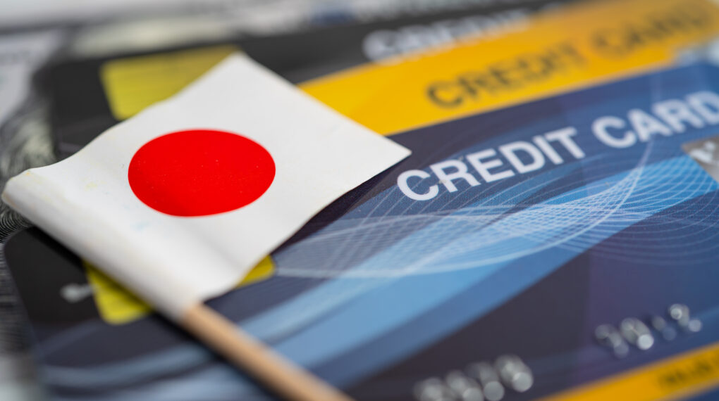 Japan flag on credit card. Finance development, Banking Account, Statistics, Investment Analytic research data economy, Stock exchange trading, Business company concept.