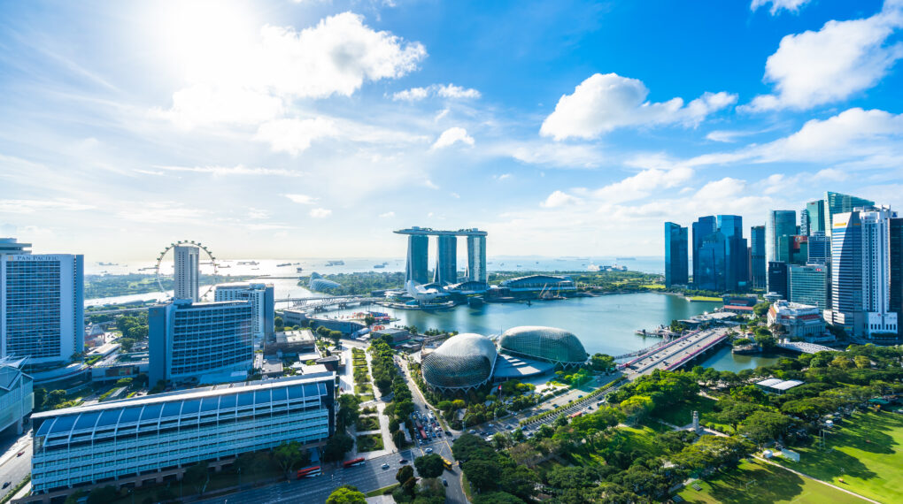 Beautiful architecture building exterior cityscape in Singapore city skyline with white cloud on blue sky
