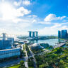 Beautiful architecture building exterior cityscape in Singapore city skyline with white cloud on blue sky