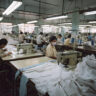 textile-factory-with-workers-sewing-fabric-into-finished-products